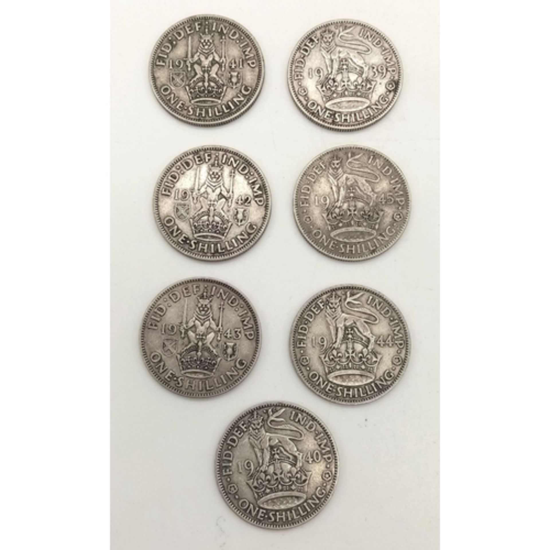 A Consecutive Run Date Set of 7 WW2 Period Silver Shillings Dates 1939-1945 Inclusive. All Fine to