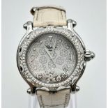 A LADIES "CHOPARD" HAPPY SPORT WATCH WITH 3 FLOATING DIAMONDS PLUS A FLOATING DIAMOND STAR ON