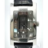 A DUNHILL STAINLESS STEEL TANK STYLE WATCH WITH FACETED GLASS FACE ON A BLACK LEATHER STRAP . 25 X