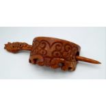 A very rare and collectable, archaic, Chinese, orange-brown jade hairpin crown, with hand carved