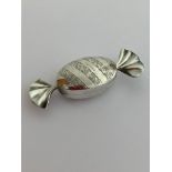 Vintage SILVER PILL BOX in the attractive and unusual form of a wrapped toffee. Having full UK