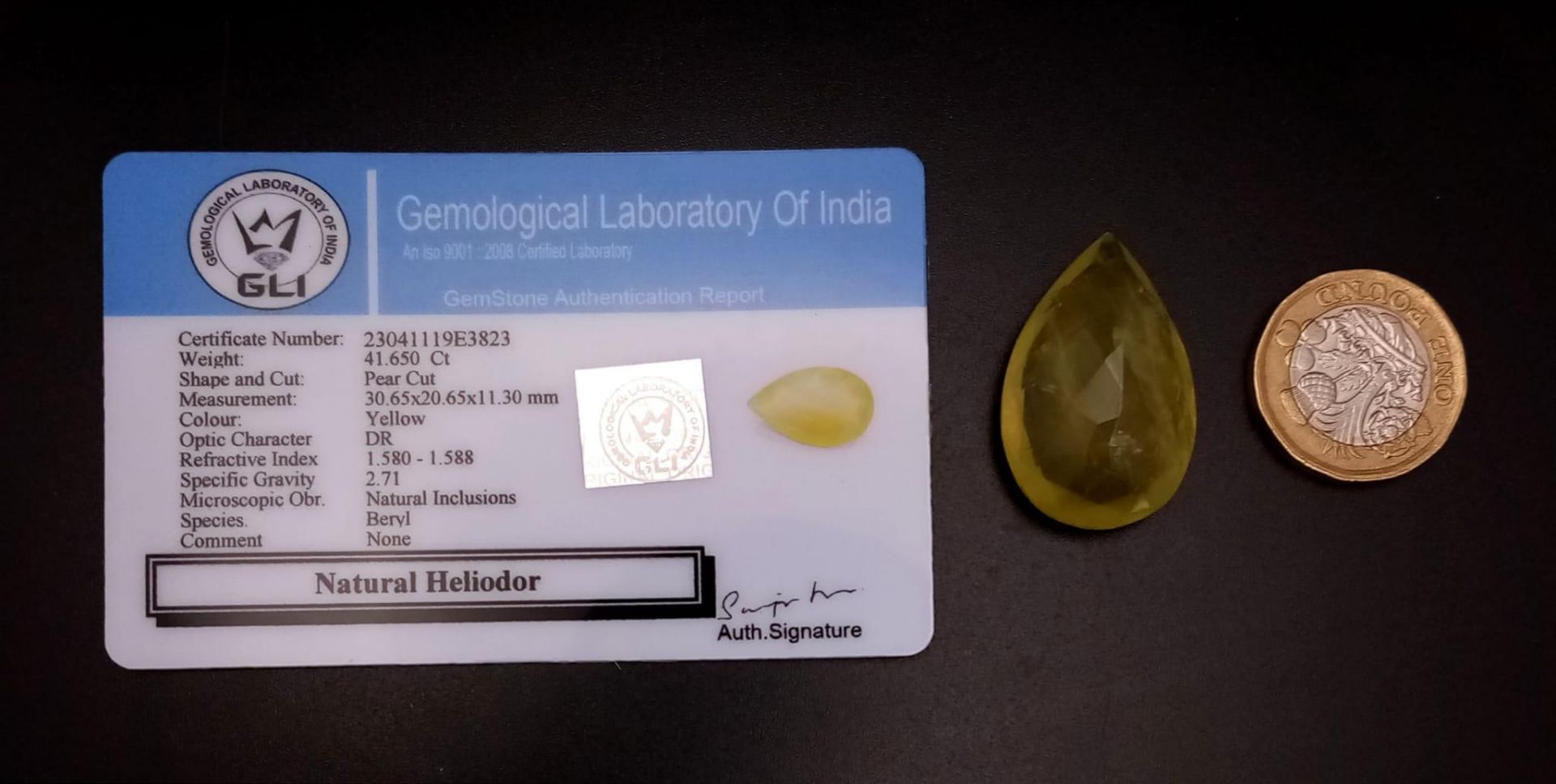 A 41.65ct Faceted Heliodor Yellow Aquamarine Pear-Shaped Gemstone. Comes with a GLI Certificate. - Image 4 of 4