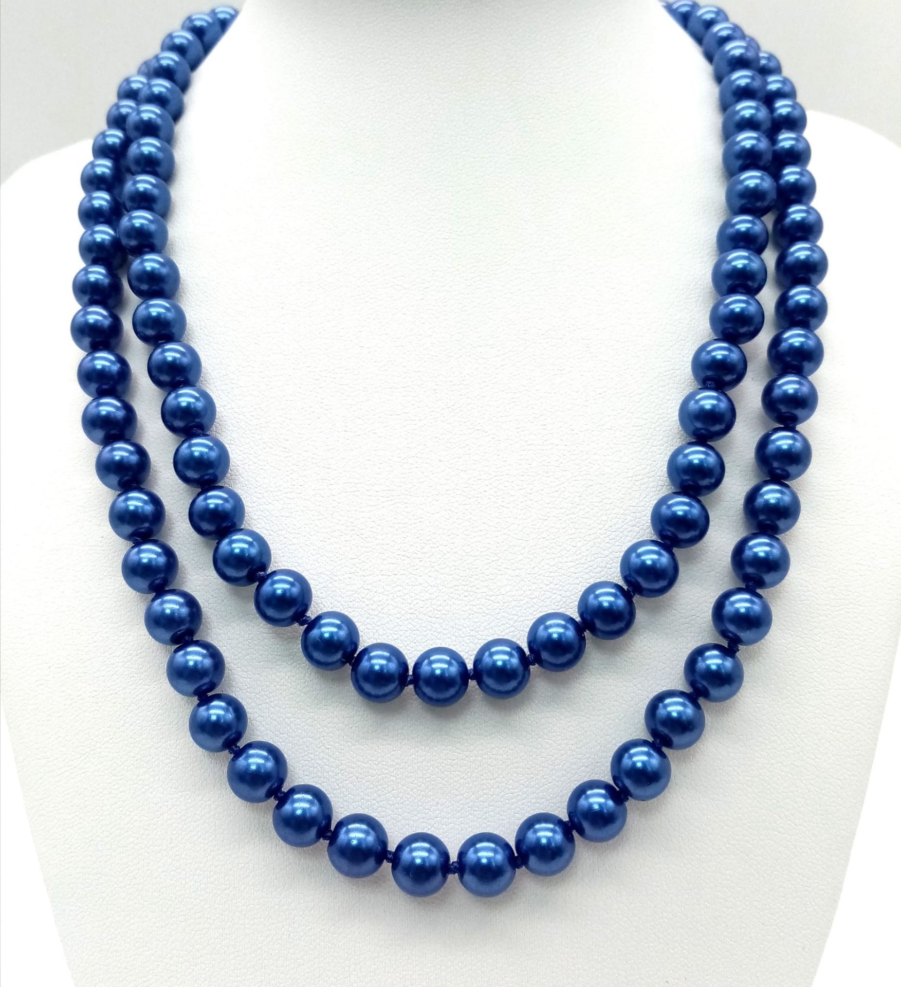 A Matinee Length Metallic Blue South Sea Pearl Shell Necklace. Beads - 8mm. Necklace length - 88cm.