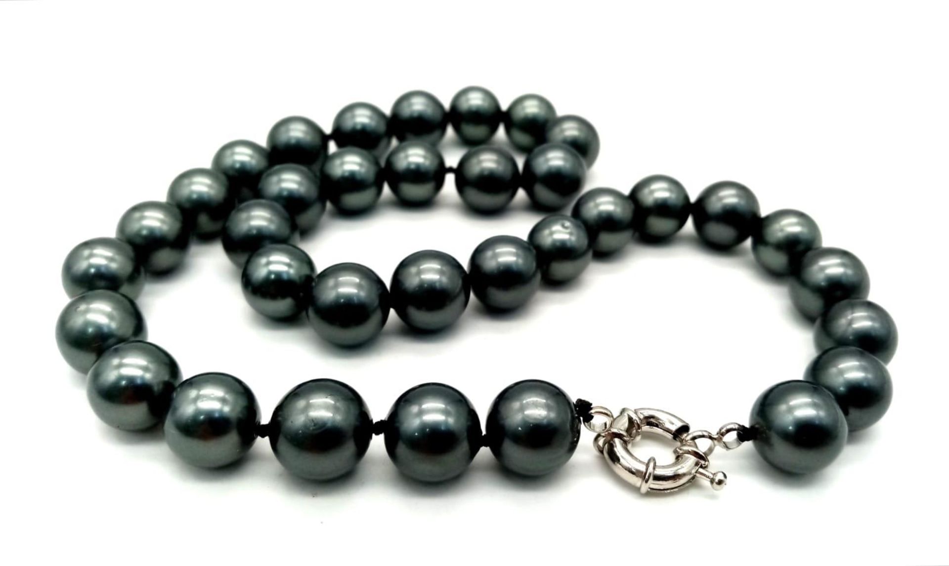 A Metallic Grey South Sea Pearl Shell Necklace. Beads - 12mm. Necklace length - 42cm.