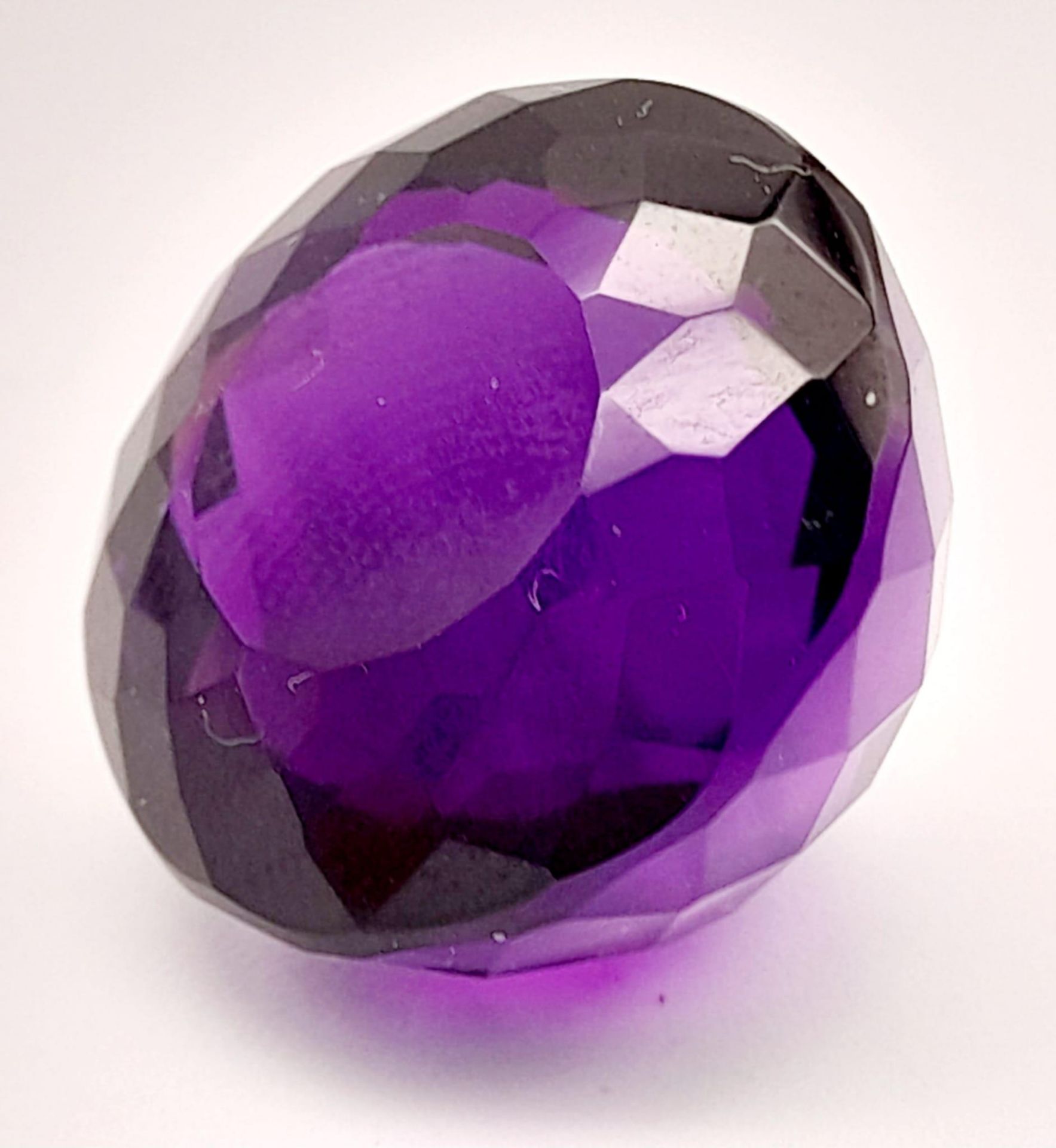 A 36ct Amethyst. Well faceted. Cushion trillion cut. 20mm x 15mm. No certificate so a/f.