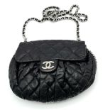 A Black Chanel Quilted Leather CC Shoulder Bag with Flap Chain surrounding it. One main