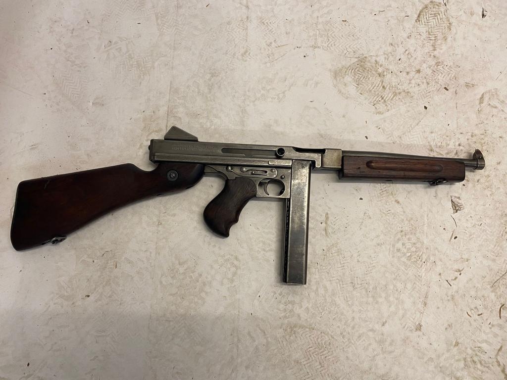 A Deactivated Thompson Submachine Gun. Rear moving bolt under spring pressure. 11 inch barrel