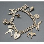 A wonderful, vintage, chain bracelet with 10 charms. Total weight: 44.5 g.