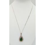 A sterling silver chain (length: 45 cm), with a pear cut peridot pendant (23 x 14 x 4.5 mm), total