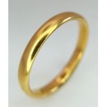A 22K GOLD BAND RING . 5gms size X
