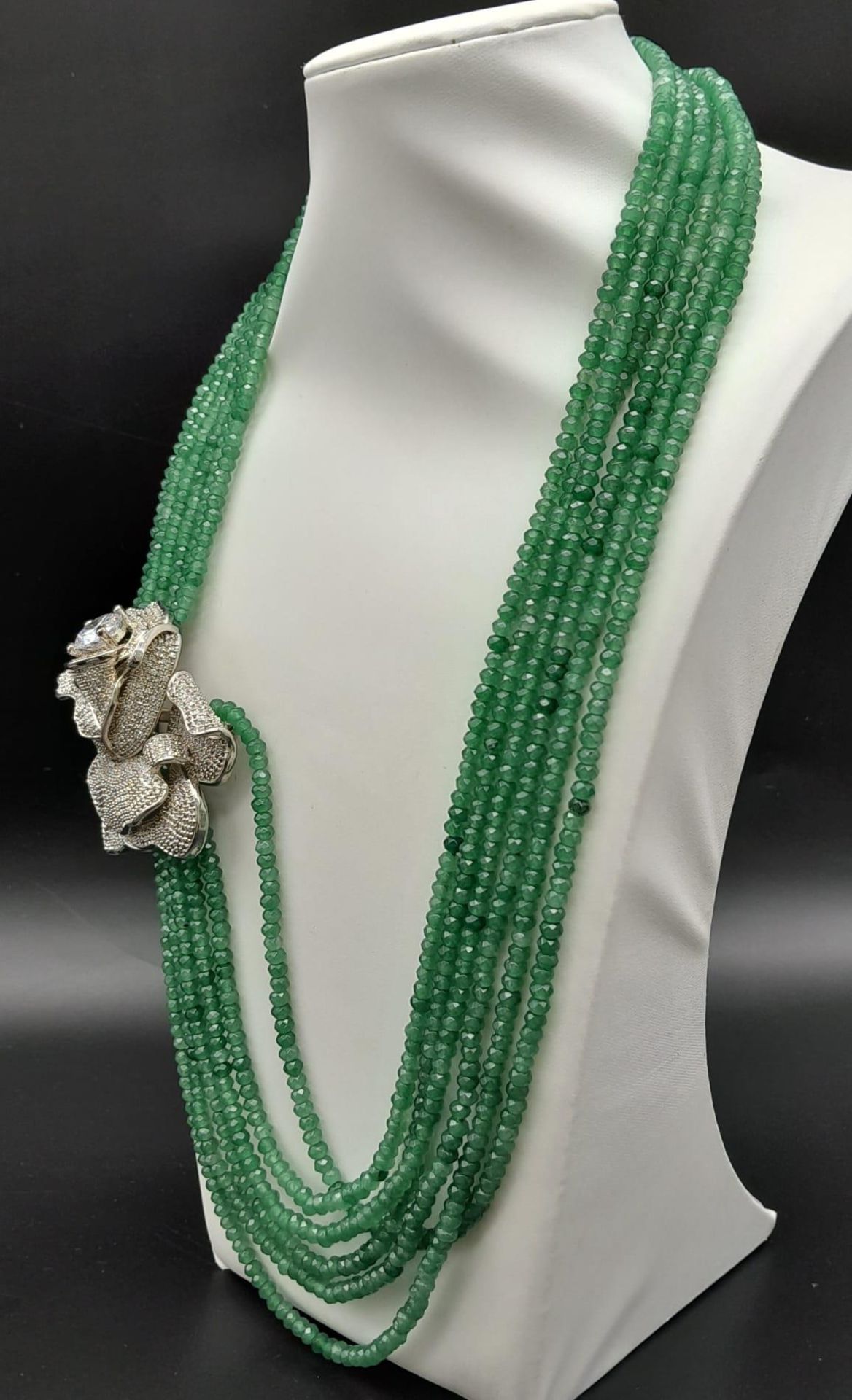 An impressive, six row necklace with faceted emerald beads and highly ornamental, white metal ( - Image 2 of 5