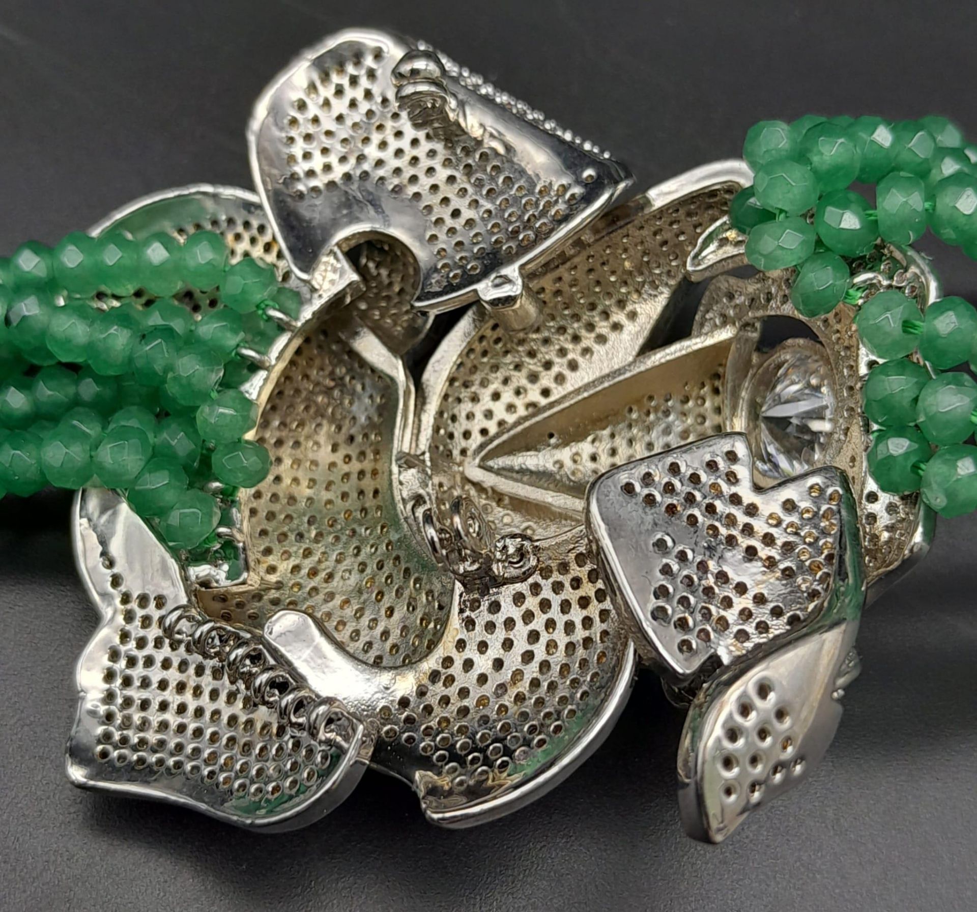 An impressive, six row necklace with faceted emerald beads and highly ornamental, white metal ( - Image 5 of 5