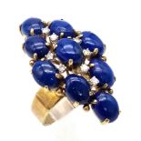 A DESIGNER 18K GOLD RING WITH LAPIS LAZULI AND DIAMONDS . 10.4gms