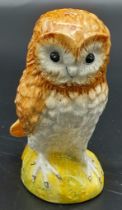 A VINTAGE "BESWICK" OWL FIGURINE IN GOOD CONDITION . 66.4gms 9cms