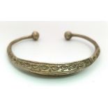An antique and unusual silver bangle with nicely engraved design. Weight: 25. 3 g.