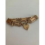 Vintage 9 carat GOLD GATE BRACELET . Having attractive fancy design links with patterned 9 ct GOLD