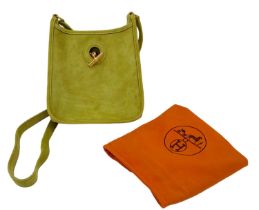 A Vintage Hermes Green Suede Shoulder Bag. Olive green suede exterior with gold-tone furniture.