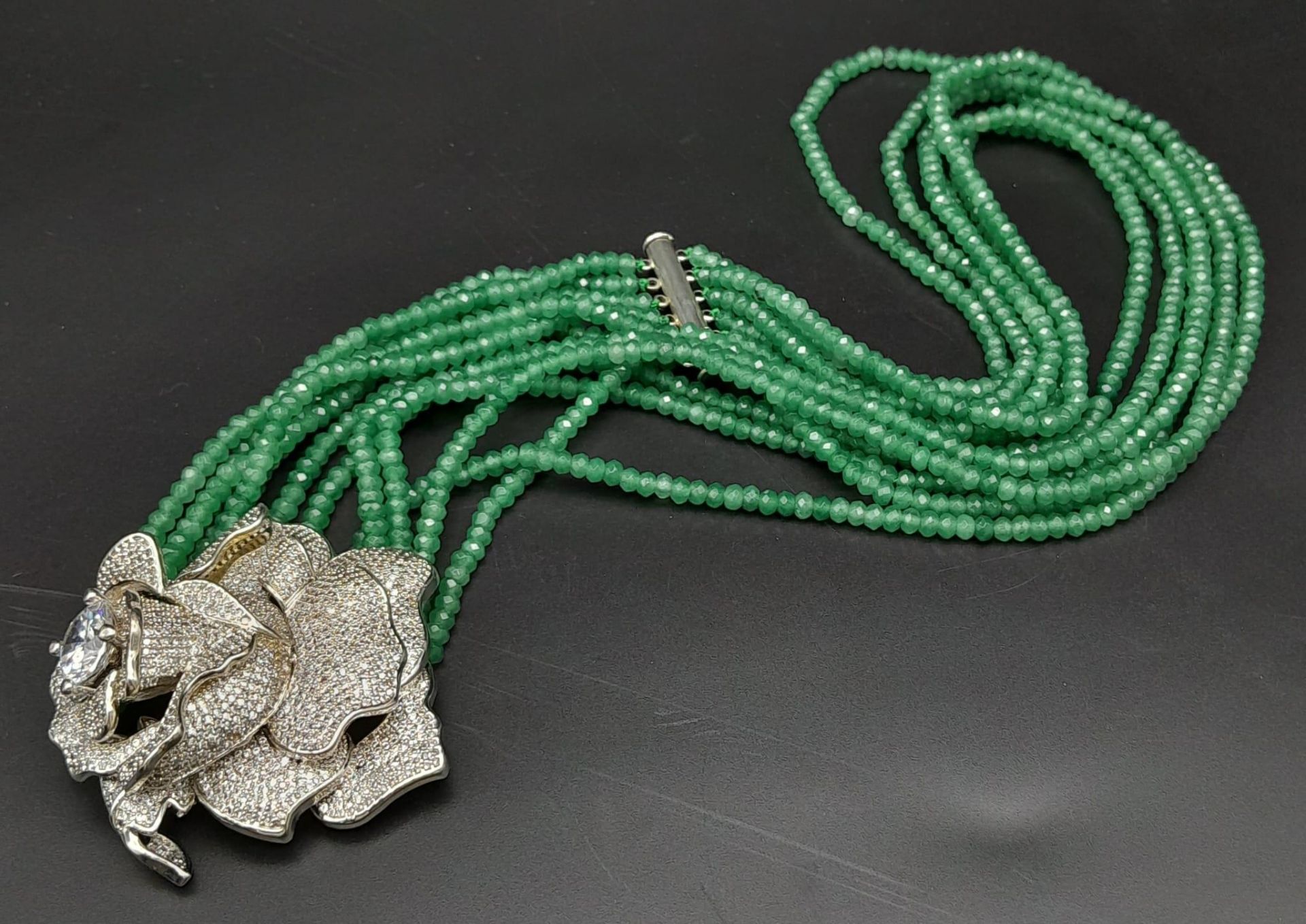 An impressive, six row necklace with faceted emerald beads and highly ornamental, white metal ( - Image 3 of 5