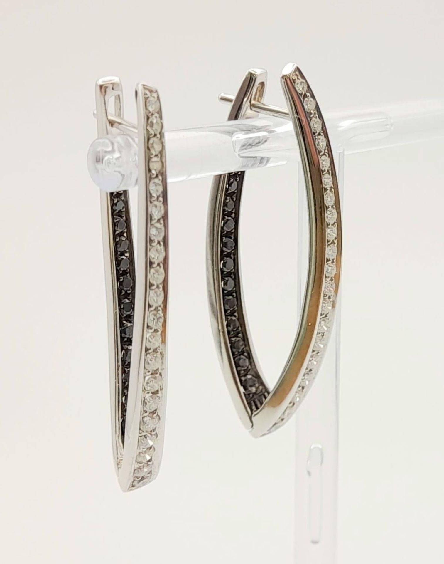 A Pair of Designer Palmiero 18K White Gold, Black and White Diamond Elongated Hoop Earrings. 0. - Image 3 of 9