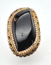 AN ANTIQUE 14K GOLD DRESS RING WITH A POLISHED WHITBY JET STONE . 10.1gms size R