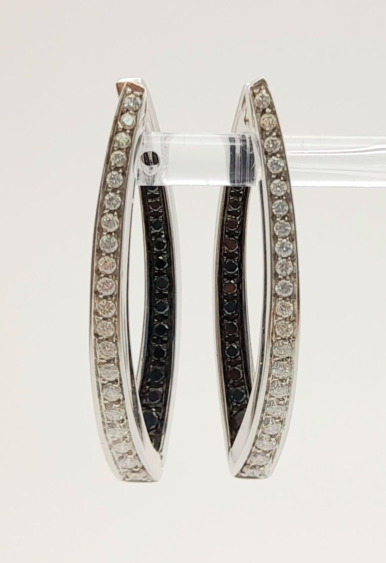 A Pair of Designer Palmiero 18K White Gold, Black and White Diamond Elongated Hoop Earrings. 0. - Image 2 of 9