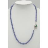 A 95ct Tanzanite Gemstone Single Strand Necklace with Emerald Clasp. 3mm beads set in 925 Silver.