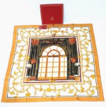 A Cartier Silk Scarf. As new, in Cartier box with authenticity card.