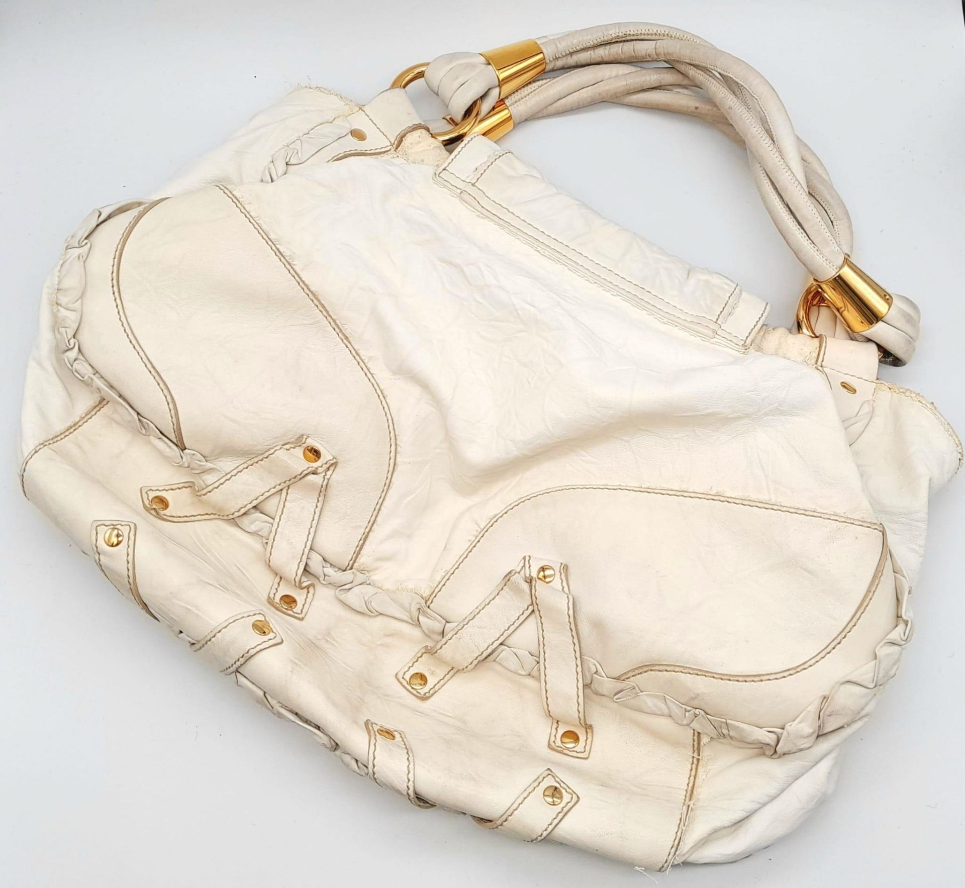 A Dolce and Gabbana Vintage Anniversary Handbag. White leather exterior with twin pockets. Gold tone - Image 3 of 10