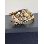 Beautiful 9 carat GOLD and OPAL RING in unusual double crossover style with twin mounted OPALS set