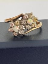 Beautiful 9 carat GOLD and OPAL RING in unusual double crossover style with twin mounted OPALS set