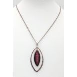 A sterling silver chain necklace with an interesting double pendant with dichroic glass insert.