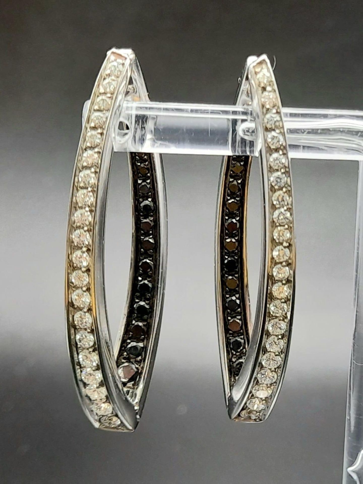 A Pair of Designer Palmiero 18K White Gold, Black and White Diamond Elongated Hoop Earrings. 0.