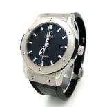 HUBLOT CLASSIC FUSION AUTOMATIC WATCH, SKELETON BACK, BLACK FACE WITH DATE BOX, SILVER DIAL AND