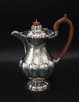 An Edward VII planished silver coffee biggin, Nathan & Hayes, Chester 1909. Having a part lobed
