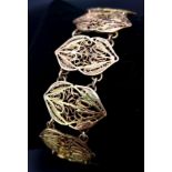AN 18K GOLD FILIGREE GRECIAN STYLE BRACELET , WITH SAFETY CHAIN . 24.9gms 18cms