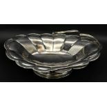 A SOLID SILVER FRUIT DISH WITH HANDLE DATED 1912 AND MADE IN SHEFFIELD , NICE CONDITION FOR AGE .