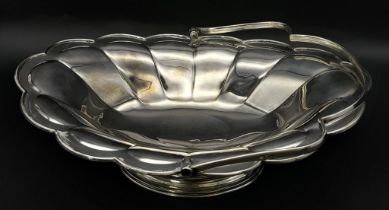 A SOLID SILVER FRUIT DISH WITH HANDLE DATED 1912 AND MADE IN SHEFFIELD , NICE CONDITION FOR AGE .