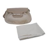 A Cartier Beige Canvas and Leather Shoulder Bag. Fold over top closure. Silver-tone hardware.