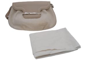 A Cartier Beige Canvas and Leather Shoulder Bag. Fold over top closure. Silver-tone hardware.