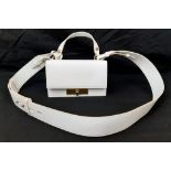 An Alexander McQueen Deep Ivory Leather Clutch Bag with Gold Skull Detail. Beige Suede Interior,