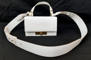 An Alexander McQueen Deep Ivory Leather Clutch Bag with Gold Skull Detail. Beige Suede Interior,