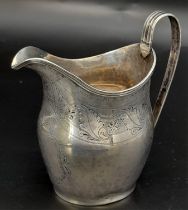 An Antique George III Sterling Silver Cream Jug. Hallmarks for London 1800. 11cm tall. 93.3g weight.