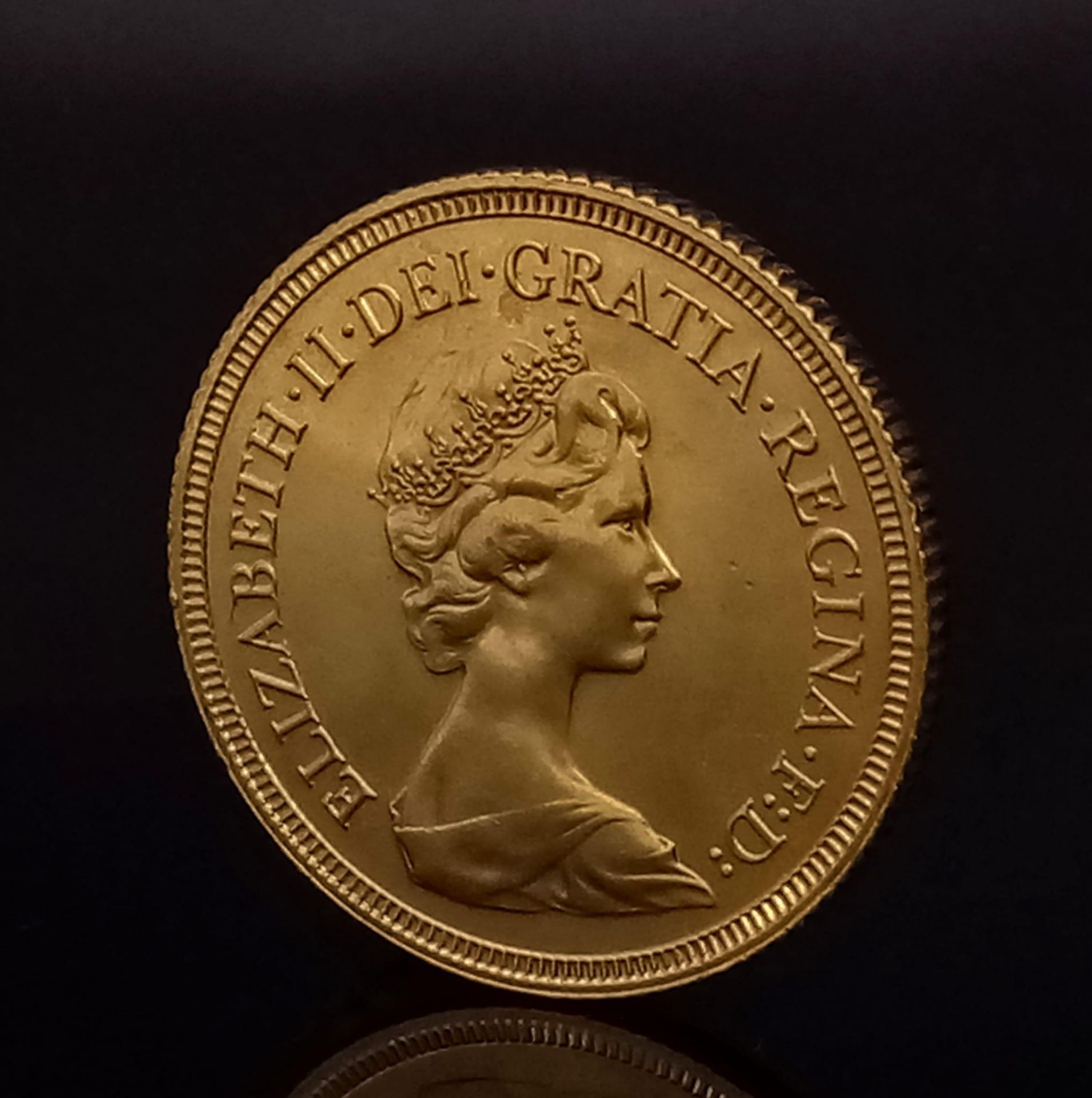A 1981 22k Gold Elizabeth II Full Sovereign. Comes in original case. EF but please see photos. - Image 2 of 4