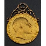 AN EDWARD VII 22K GOLD HALF SOVEREIGN WITH 9K GOLD PENDANT SETTING . 4.4gms