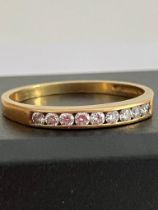 18 carat GOLD and DIAMOND RING, Slim style having 9 Round cut DIAMONDS channel set to top. Full UK
