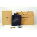 A Luxury Loewe Black Leather Papelle Tote Bag. Soft black leather exterior. Red textile interior