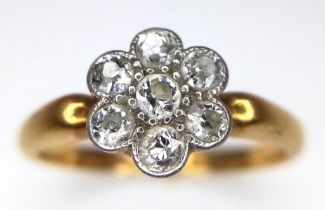 AN 18K GOLD DIAMOND CLUSTER RING IN FLORAL FORM , WITH A CHESTER HALLMARK. 2.5gms size K
