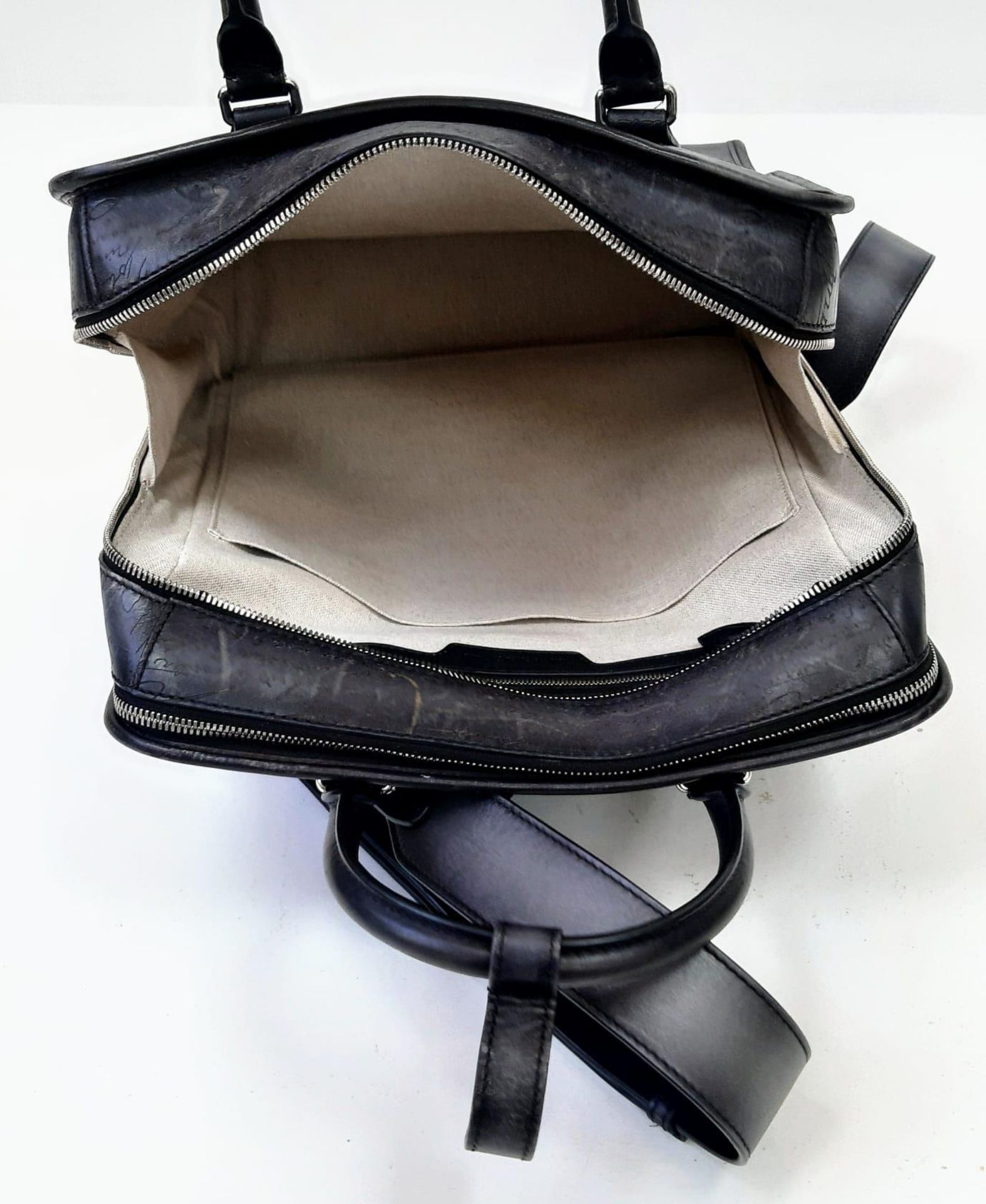 A Berluti Black Leather Satchel. Exterior in scritto leather design with zipped pocket. Spacious - Image 6 of 6