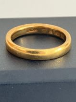 22 carat GOLD BAND RING. Full UK hallmark. Complete with ring box. 4.57 grams. Size K.