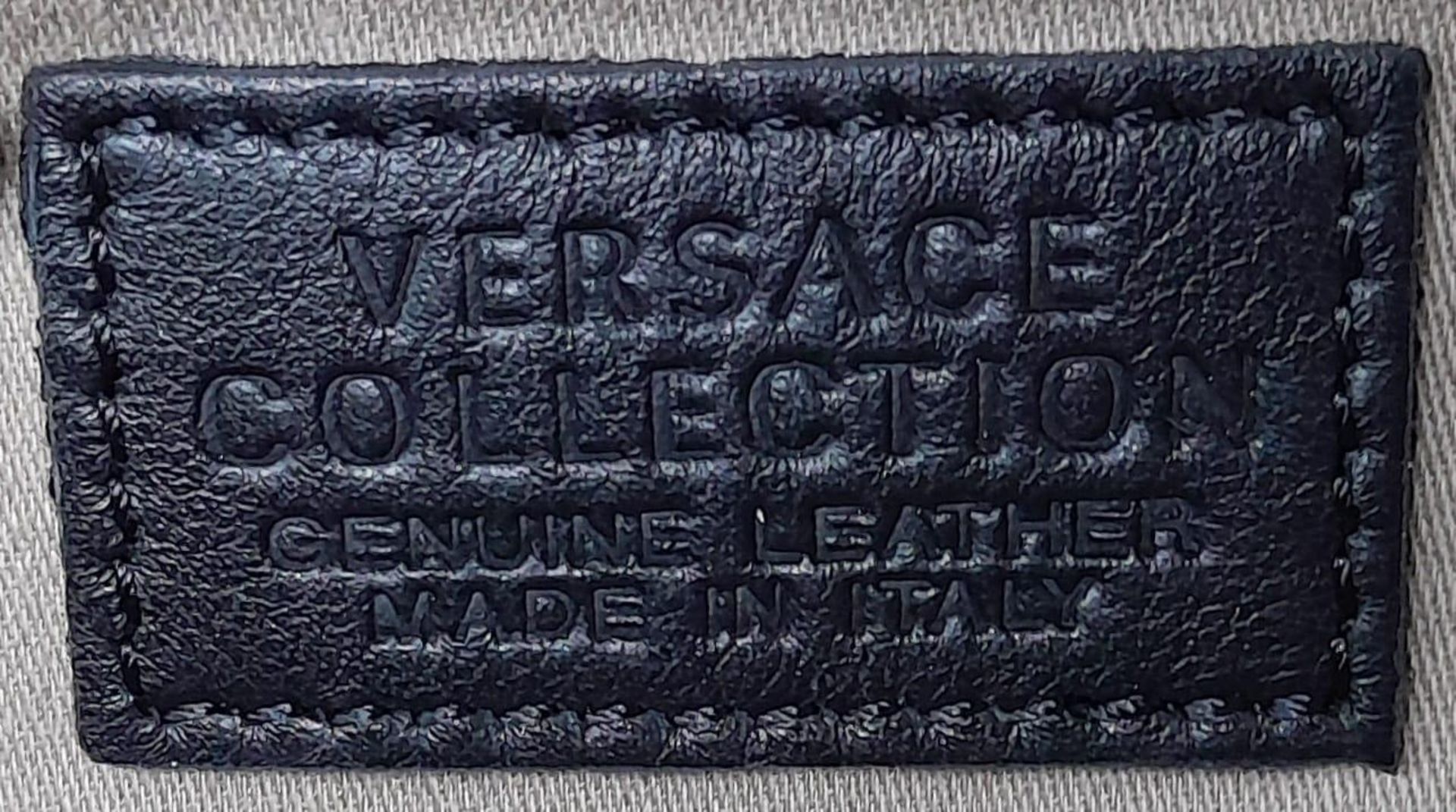 A Versace Collection Black Textured Leather Handbag. Black leather exterior with gilded main zip. - Image 10 of 12